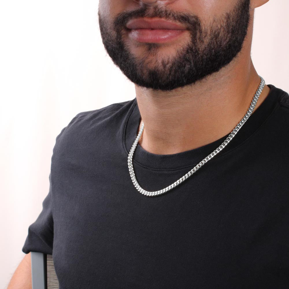 Stainless steel Cuban link chain necklace worn by man — wide curb link silver chain showing full length and drape, men's Father's Day jewelry gift