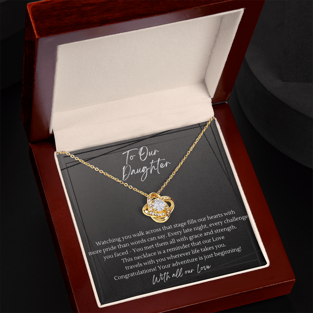 Gold love knot necklace in open mahogany luxury gift box — graduation gift for daughter with heartfelt congratulations message card and LED spotlight