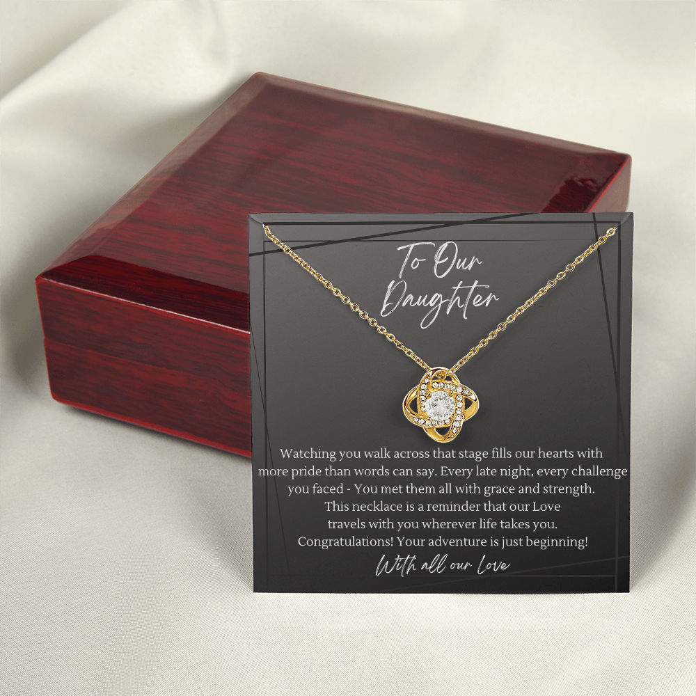 Gold love knot necklace with crystal pendant on daughter graduation keepsake message card — mahogany luxury gift box, meaningful congratulations jewelry gift